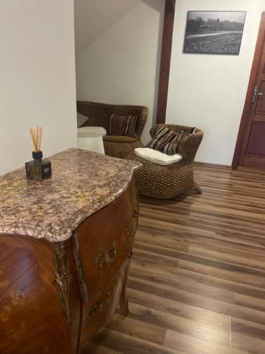 a living room with a table and chairs at NH resort in Frýdek-Místek