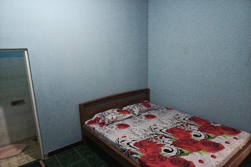 Postel nebo postele na pokoji v ubytování Hotel O Dian Asih Rooms