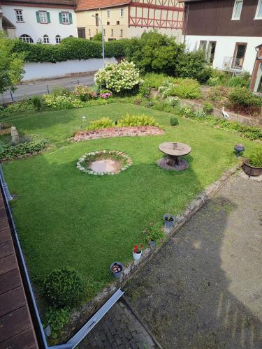 an aerial view of a garden with a table in the grass at Ferienwohnung am Rittergut 100qm in Grebenstein