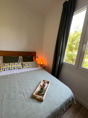 a bedroom with a bed with a tray on it at Apartament de la Madrona 1st floor Easy street parking in Tarragona