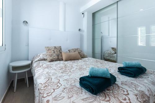 a bedroom with a bed with two pillows on it at Bellavista in Tías