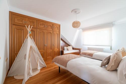 Ένα ή περισσότερα κρεβάτια σε δωμάτιο στο Villa Comesaña