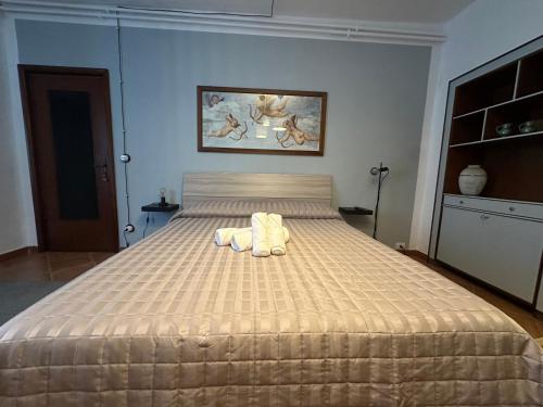 a bedroom with a bed with two towels on it at B&B Ronco Oste in Travo