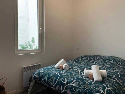 Postel nebo postele na pokoji v ubytování Appartement hyper centre au coeur de Libourne