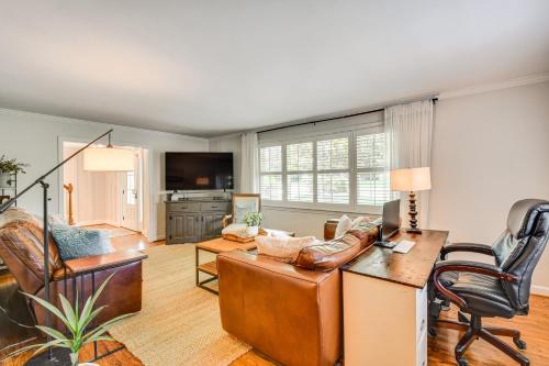 a living room with a couch and a table at Spacious Taylors Home about 5 Mi to Dtwn Greenville! in Taylors