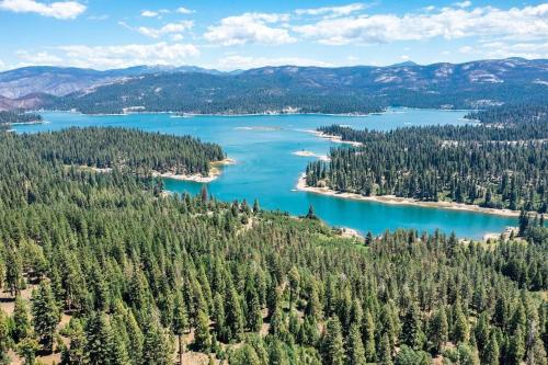 an aerial view of a lake in the mountains at Buckeye Bear's Den-ac-walking Distance To Town in Shaver Lake