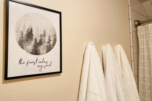 a bathroom with a picture of a forest with trees at The Elderberry Retreat - It's A Dream Location! in Shaver Lake