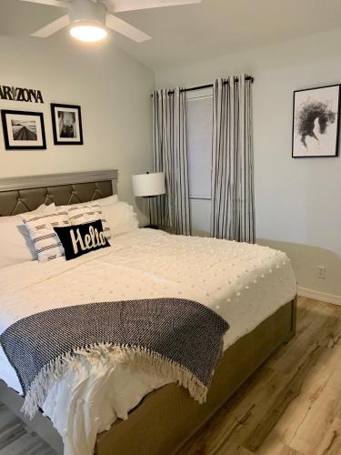 a bedroom with a large bed and a window at Rustic Farmhouse Old Town Condo W Patio & Pool in Scottsdale
