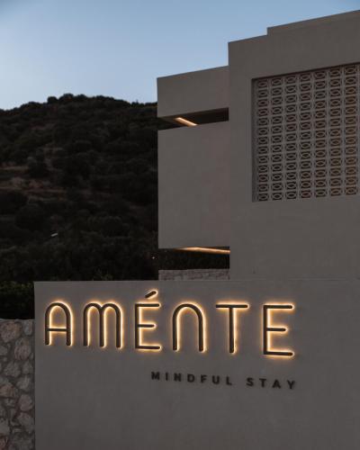 a building with a sign that reads anpire at AMÉNTE Mindful Stay in Plakias