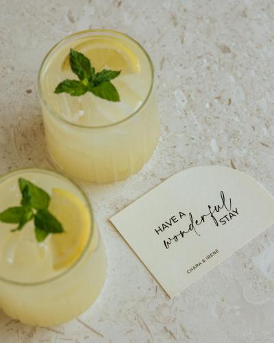 two glasses of lemon margaritas with a piece of paper at AMÉNTE Mindful Stay in Plakias