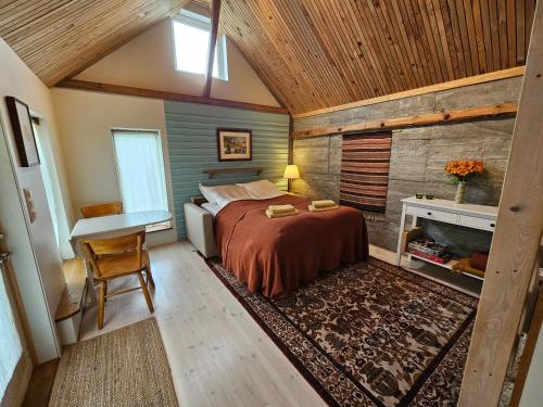 Ένα ή περισσότερα κρεβάτια σε δωμάτιο στο Sigurd's Tiny House