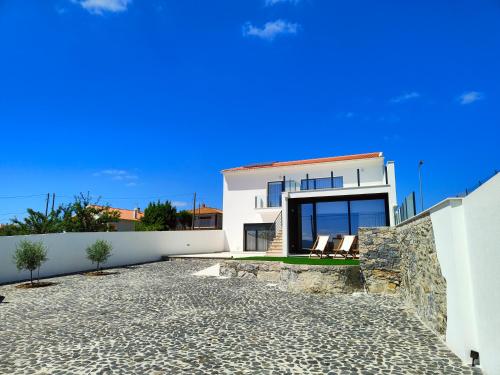 a villa with a view of a house at Casa de Lazer da Chã in Alqueidão da Serra