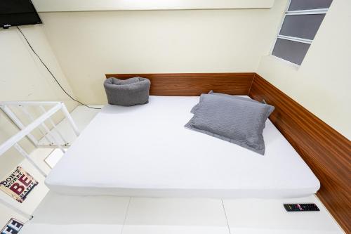 Ein Bett oder Betten in einem Zimmer der Unterkunft Pousada com Banheiro Privativo Proximo a Expo e Metro