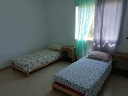Postel nebo postele na pokoji v ubytování Rimel - Bizerte belle demeure entre plage et forêt