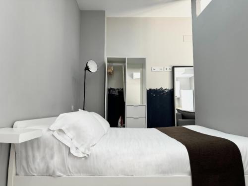 Letto o letti in una camera di PlazaMayorSuites