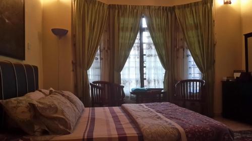 Postel nebo postele na pokoji v ubytování Roemahkoe Holidayhome
