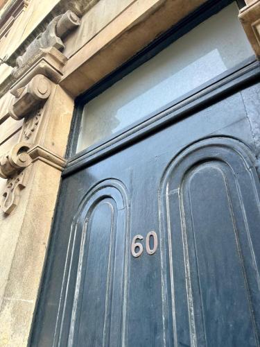 a black door with the number on it at Clifton Apartment in Bristol