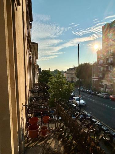 a balcony with a row of plants on a building at Clifton Apartment in Bristol