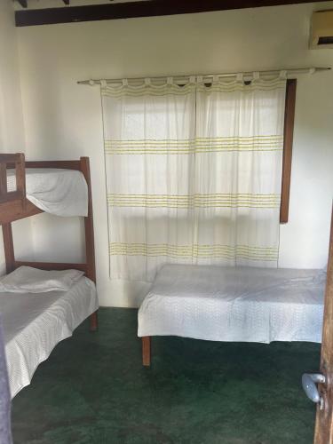 Casa Bella barra do Jacuípeにあるベッド