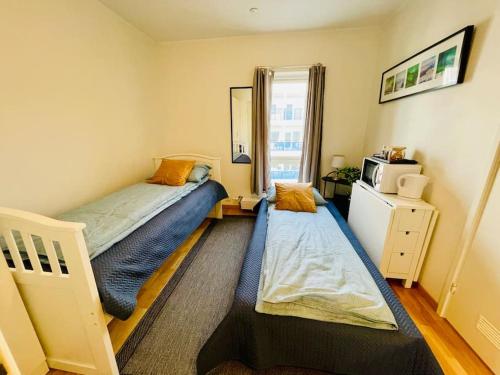 Postel nebo postele na pokoji v ubytování Studio mobiliado em Tromsø Noruega