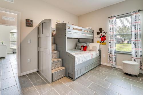 a childs bedroom with a bunk bed at Relax, Play, Swim Luxe Haines City Home with Lanai! in Haines City
