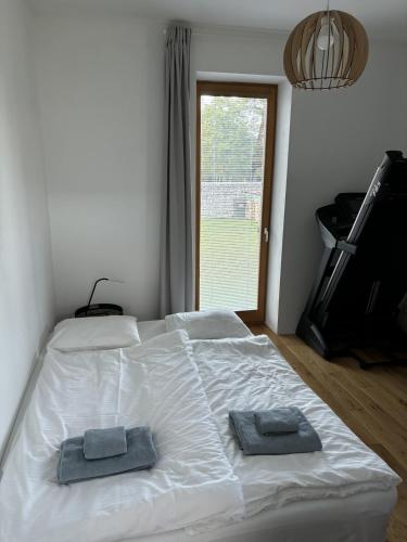 Ένα ή περισσότερα κρεβάτια σε δωμάτιο στο Chalet Deer Trail Tatranská Lomnica