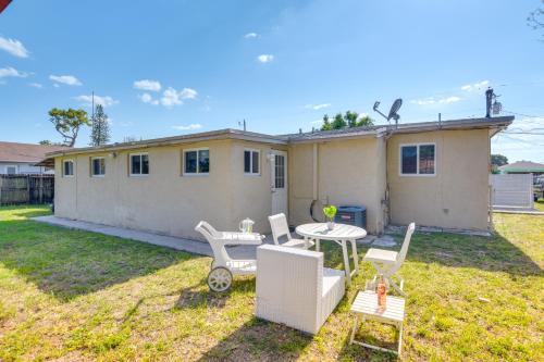 a house with a table and chairs in a yard at Miami Gardens Apt 5 Miles to Hard Rock Stadium in Miami Gardens