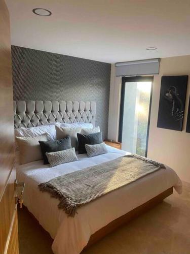 Postel nebo postele na pokoji v ubytování Hermoso loft con excelente ubicación y amenidades
