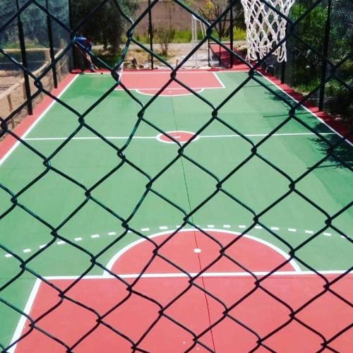a basketball hoop with a net on a court at Ferme ADAM Agafay Marrakech in Marrakech