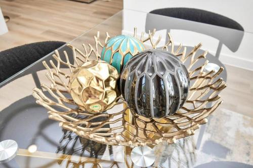 three eggs in a basket on a glass table at Chateau de Amour- Exquisite Townhouse - Medical Center, Downtown HTX in Houston