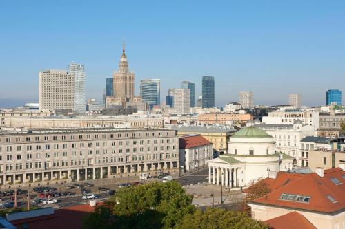 a view of a city with tall buildings and cars at Sheraton Grand Warsaw in Warsaw