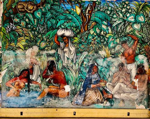 a wall with a painting of people in the jungle at Suite CasaBlanca Grand, la mejor vista de Acapulco in Acapulco