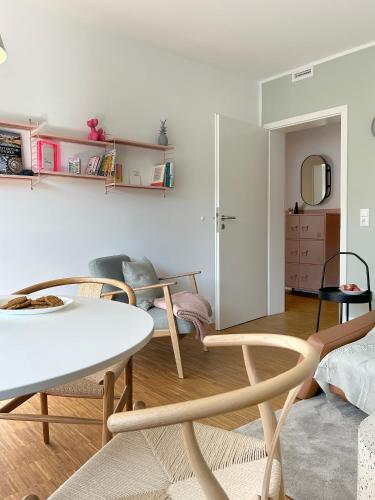 a living room with a table and chairs at neues trendy Appartement in Hannover in Hannover