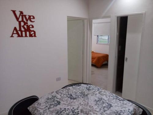 a room with a bed in a room with a bedroom at La casa de Bada in Miramar