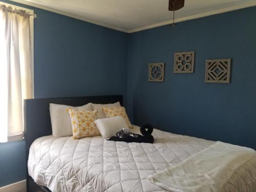 a bedroom with a bed with a teddy bear on it at Private Room in Cozy home in Memphis