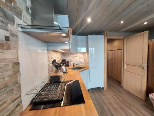 Appartement 4-6p Belle Plagne, skis aux pieds, vue montagne, ensoleillé