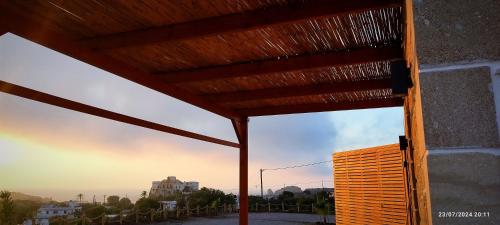 a view from a building with a wooden roof at Holy Sea Smart Suites in Elafonisi