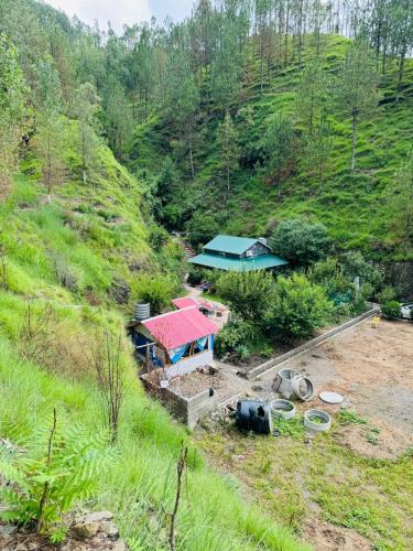 an aerial view of a house on a hill at Hidden Resort Abbottabad in Abbottabad