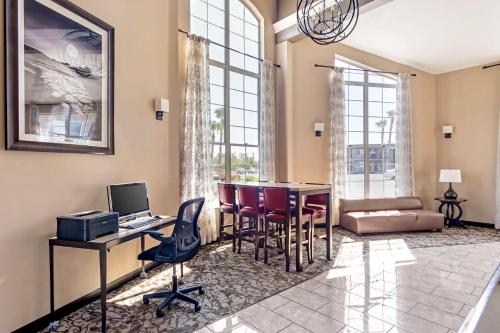 a home office with a desk and chairs and a computer at Best Western China Lake Inn in Ridgecrest