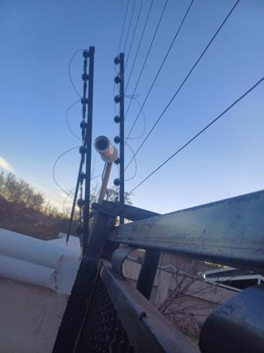 a view of a bench with a pole and some power lines at Gugulethu Villa in Rensburgdorp