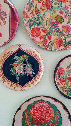 a group of plates sitting on a table at Birdsong Bungalow in Port Dover