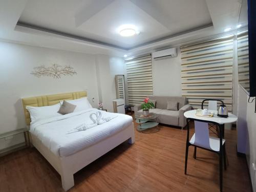 Postel nebo postele na pokoji v ubytování SouthPark Hotel Naga