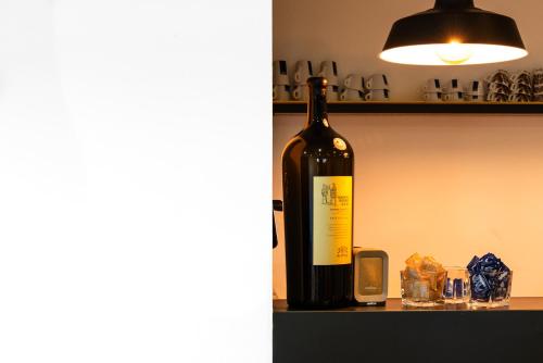 a bottle of wine sitting on a shelf at AGRITURISMO 8e28 CAPALBIO in Nunziatella