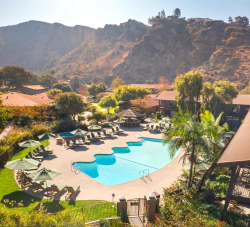 an aerial view of a resort with a pool and chairs at The Ranch at Laguna Beach in Laguna Beach