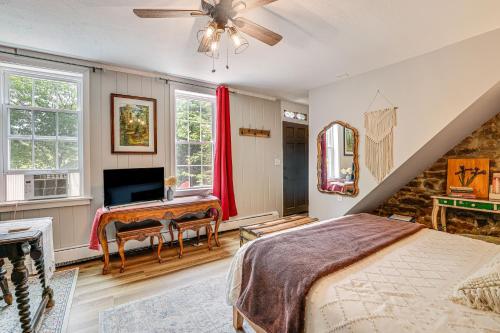 a bedroom with a bed and a desk at Charming Getaway Less Than 1 Mi to Downtown Lambertville! in Lambertville