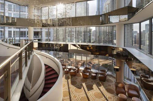 a view of a lobby with chairs and windows at Residence Inn by Marriott Chicago Downtown Magnificent Mile in Chicago