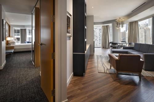a living room with a couch and a table at Residence Inn by Marriott Chicago Downtown Magnificent Mile in Chicago