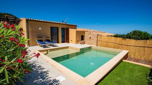 a swimming pool in the backyard of a house at Villa Vincent in Costa Paradiso