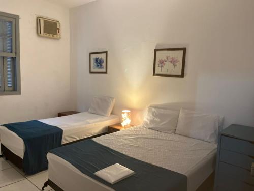 Ένα ή περισσότερα κρεβάτια σε δωμάτιο στο Casa terrea 4 quartos Expo SP