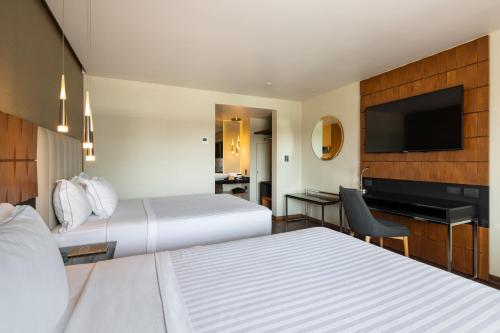 Postel nebo postele na pokoji v ubytování Hotel Real del Rio